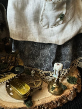Load image into Gallery viewer, Detail of the clockwork tools and small brass objects at Madame Tinker’s base