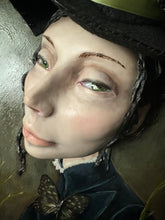 Load image into Gallery viewer, Close portrait of Edris with green eyes and moss-green ribbon on her witch hat
