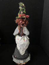 Load image into Gallery viewer, Back view of Hester Briarhollow showing her striped sleeves and apron