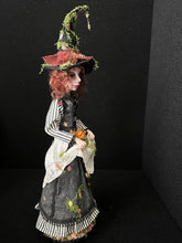 Load image into Gallery viewer, Hester Briarhollow profile view showing her autumn witch hat and gown
