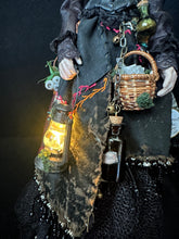Load image into Gallery viewer, Detail of the illuminated lantern, basket, and apothecary bottles