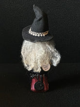 Load image into Gallery viewer, Back view of Potion Bottle Witch BW10 showing white curls and artist seal