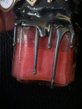 Load image into Gallery viewer, Close view of BW10 red shimmering potion and black wax