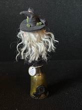 Load image into Gallery viewer, Back view of Potion Bottle Witch BW12 showing silver hair, moss-trimmed hat, and artist seal