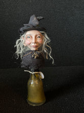 Load image into Gallery viewer, Potion Bottle Witch BW12 front view with silver hair, black lace capelet, and dragon claw ornament