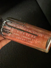 Load image into Gallery viewer, Close view of BW4 Viktor red shimmering potion in embossed bottle