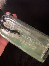 Load image into Gallery viewer, Embossed Dr. W. B. Caldwell's Syrup Pepsin medicine bottle